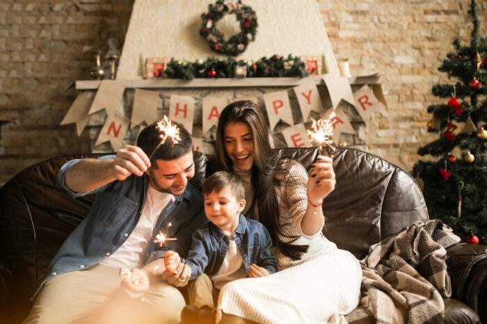 Family on New Years Eve with bengal lights