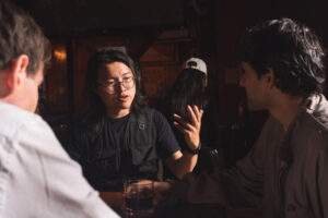 Kai Tong (2nd from left) discussing a shot during filming